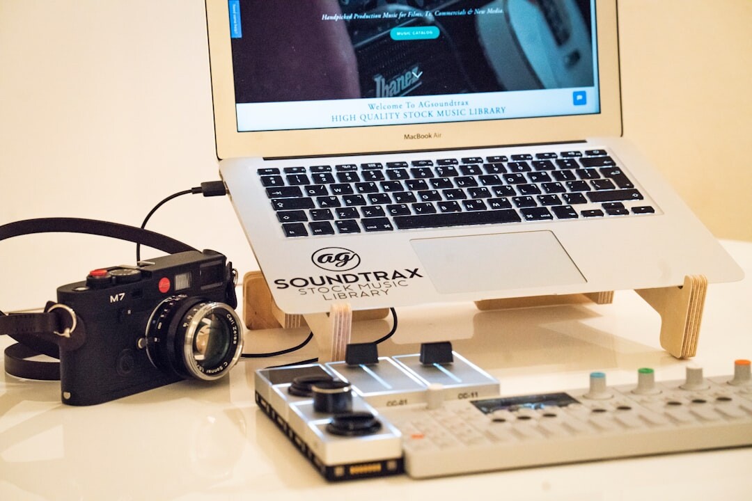 Film editor reviewing commercial footage at an analog editing table with film reels