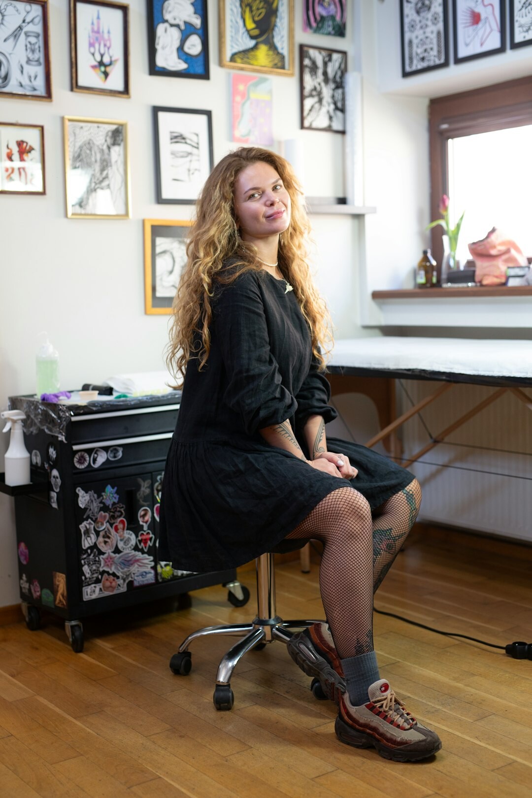 Studio portrait of a Swiss woman creative director in her forties smiling confidently